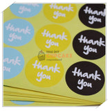 สติ๊กเกอร์ กระดาษสีฟ้า เหลือง ดำ วงกลม พิมพ์ thank you ขนาด 3.8x3.8 ซม. 10 แผ่น 90 ดวง สติ๊กเกอร์ กระดาษสีฟ้า เหลือง ดำ วงกลม พิมพ์ thank you ขนาด 3.8x3.8 ซม. 10 แผ่น 90 ดวง - อุปกรณ์เบเกอรี่
