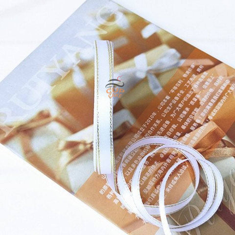 ริบบิ้น ขอบทอง แถบ 1 ซม. ม้วนยาว 25 เมตร  มีให้เลือก 2 สี